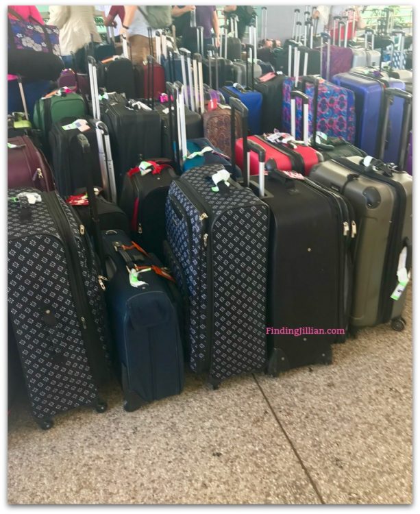 image of luggage at airport - Finding Jillian Travel Blog