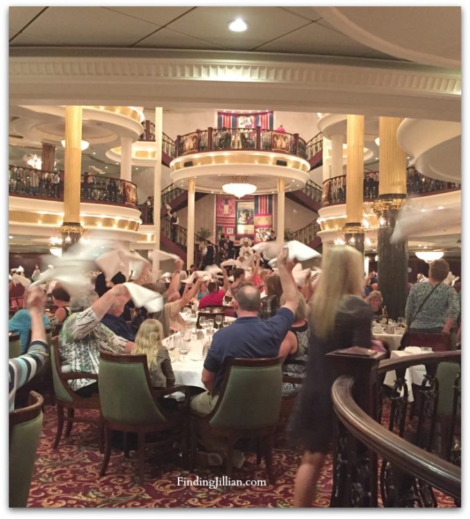 image of cruise dinner guests waving napkins