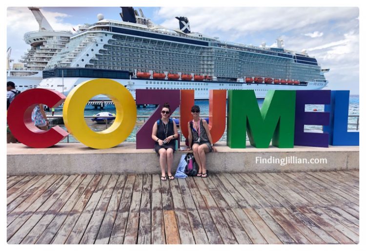 image of two women and Cozumel sign