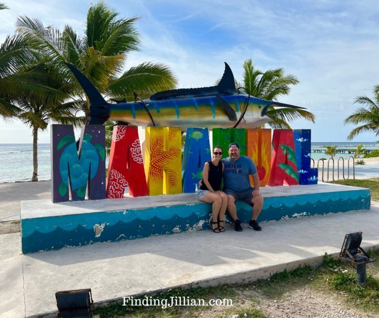 image of tourists in front of the Mahahual sign